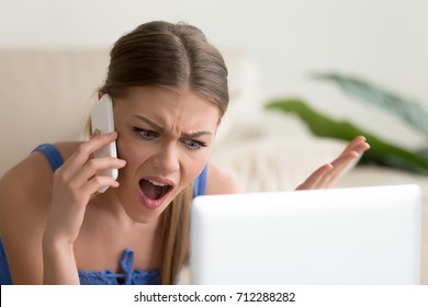Angry dissatisfied young woman calling customer support or mobile banking, displeased client complaining about bad service, arguing on phone, having conflict during telephone conversation at home - Shutterstock ID 712288282