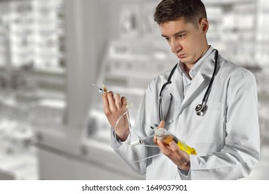 An angry doctor with a big syringe in his hands. Bad medic. Concept of young inexperienced doctor. Man in white coat on a background of shelves with medicines. - Shutterstock ID 1649037901