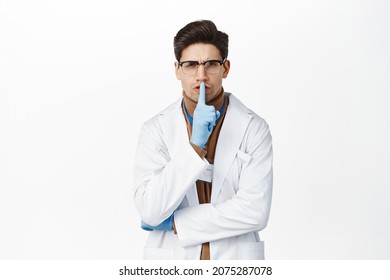 Angry Doctor Shushing, Show Taboo Sign, Press Finger To Lips And Hush, Shhh Gesture, Tell To Be Quiet, Silence, Standing Over White Background