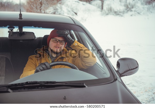 angry driver in car\
talking by phone