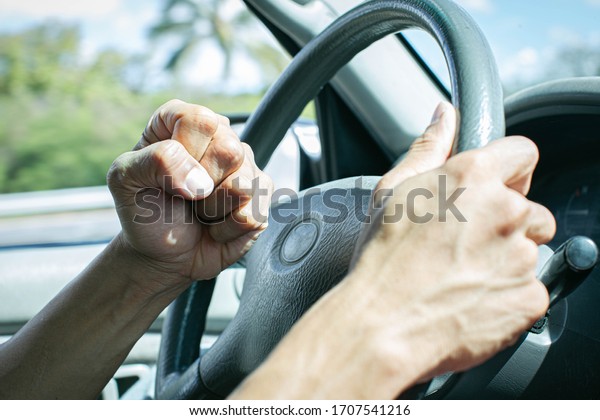 Angry\
driver honking and beeping the horn. Road\
rage.