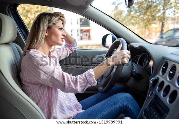 Angry\
driver losing her temper being more and more\
upset