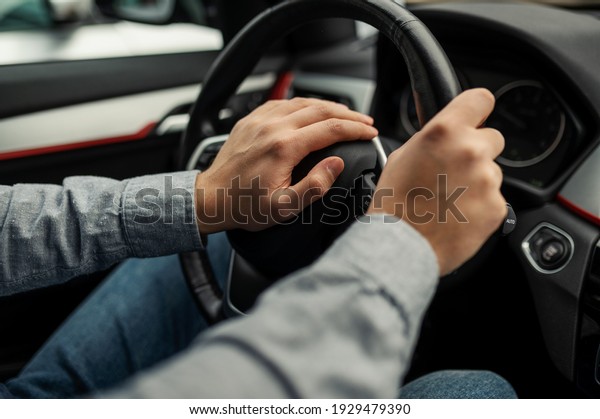 angry driver presses the horn of the car to\
attract the attention of the car bully and avoid road accident.\
Stress and aggressive driving on city\
streets