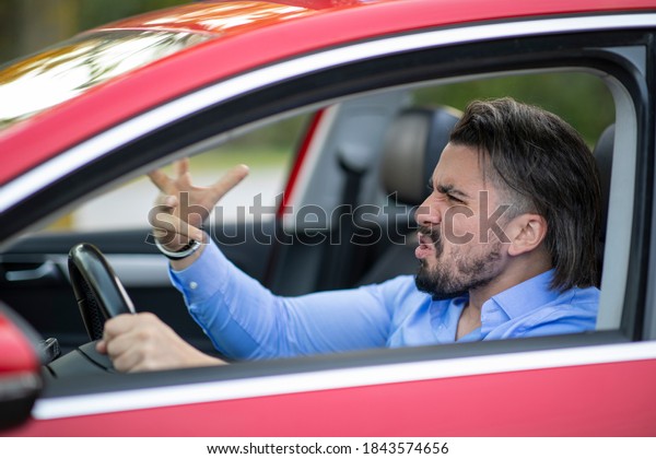 Angry driver\
shouting at someone while\
driving
