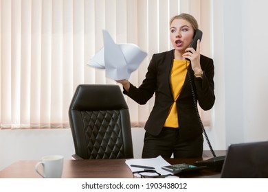 Angry Emotional Lady Boss Talking On The Phone In His Office