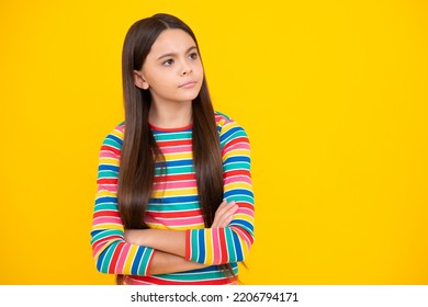 Angry Face, Upset Emotions Of Teenager Girl. Portrait Of Caucasian Teen Girl With Arms Folded, Isolated On Yellow Background. Cute Teenager Child.