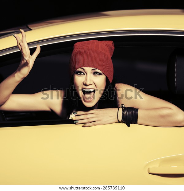 Angry fashion woman\
shouting in a car