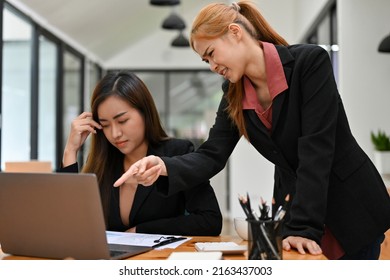 An Angry Female Boss Is Complaining To Her Assistant About Her Work Performance In The Office. A Stressed Female Employee Gets A Complaint From Her Manager.