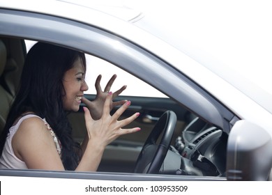 Angry Female Driver Driving A Car Isolated On White