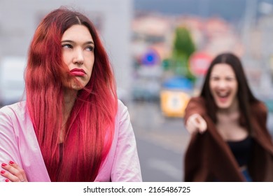 Angry Female Friends Arguing In The Street