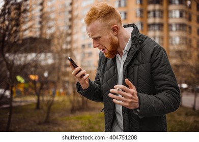 Angry Ginger Man Screaming On Phone Outdoor