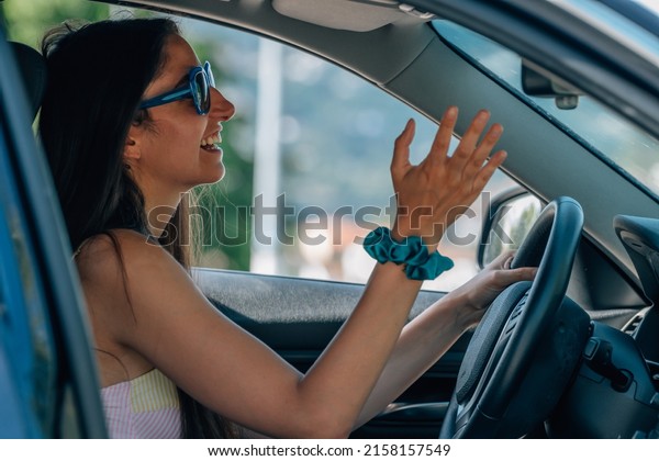 angry girl driving and\
protesting