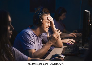 Angry Guy Gamer Playing Video Games At Night On The Computer