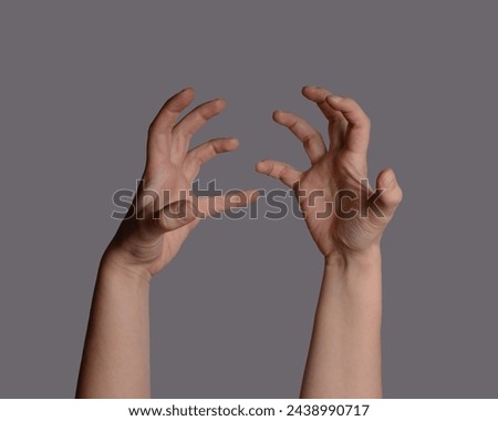 Angry hands expression pattern isolated on grey background. Spooky or creepy hands gesture. Scary zombie halloween hands.