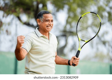 Angry indian senior men after losing the game while playing tennis at court - concept of competition, challenges and tournament - Powered by Shutterstock