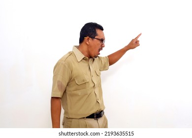 Angry Indonesian government employees standing while pointing sideways. Isolated on white - Shutterstock ID 2193635515