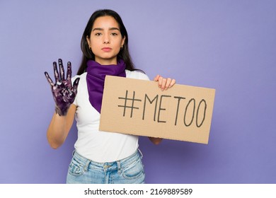 Angry Latin Woman Holding A Protest Sign With A Me Too Message Against Sexual Abuse During A Feminist March 