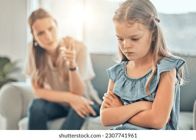 Angry lecture from mom, sad child and discipline in living room, problem with naughty girl behaviour in home. Scolding, punishment and frustrated mother, stubborn kid and communication with anger.