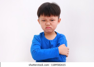 Angry little asian boy showing frustration and disagreement, isolated on white background
