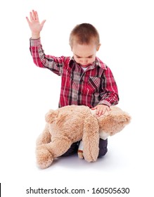 Angry Little Kid Beating His Teddy Bear - Domestic Abuse Concept