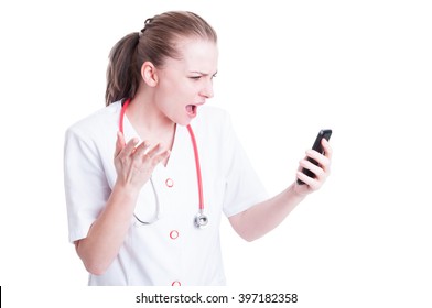 Angry mad doctor or medic woman yelling at phone as video call concept - Powered by Shutterstock