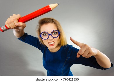 Angry Mad Woman Blonde Student Girl Or Female Teacher, Stressed Business Worker Releasing Tension By Shaking Finger. Studio Shot On Grey