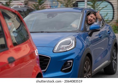 Angry Man In The Car In The Queue Yells At The Driver In Front