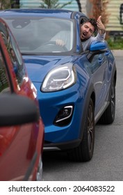 Angry Man In The Car In The Queue Yells At The Driver In Front