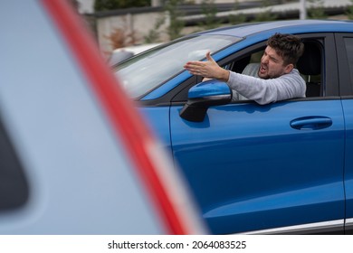 Angry Man In The Car In The Queue Yells At The Driver In Front. Side View