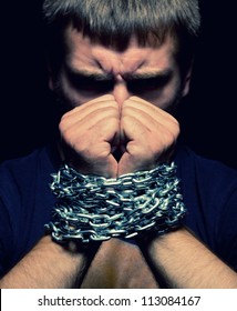 Angry Man With Chained Hands