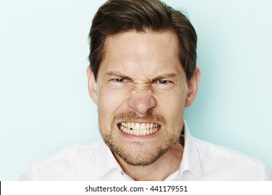 Angry Man Clenching Teeth At Camera