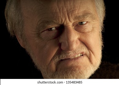 Angry man, a close up portrait of a male senior citizen.