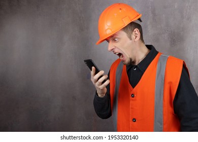 angry man construction boss shouts on the phone at subordinates. Space for text