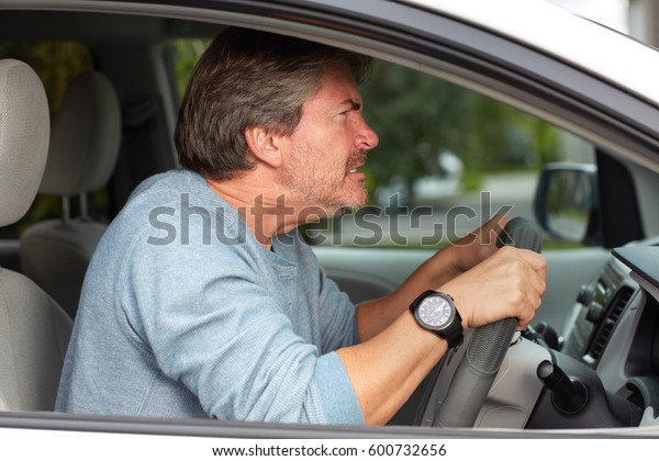 Angry man driving\
car