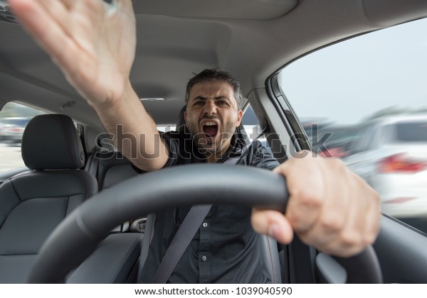 Angry man driving a\
vehicle