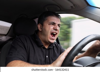 angry man driving a vehicle without seat belt 
