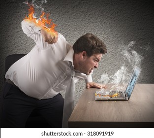Angry man gives fiery fist to computer