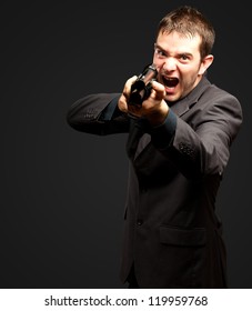 Angry Man Holding Gun Against Black Stock Photo 119959768 | Shutterstock