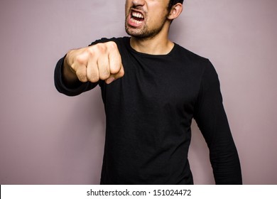 Angry Man Throwing A Punch