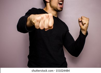 Angry Man Throwing A Punch