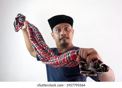 Angry Man Wearing Cap And Spread Out Sarong Cloth At Camera