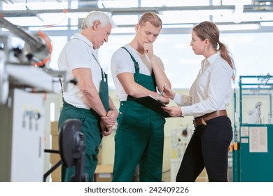 Angry Manager Controlling Employees In Manufacturing Plant