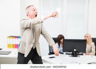 Angry Manager Throwing Away His Phone In His Office