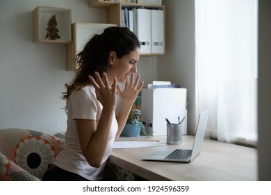 Angry millennial female freelancer feeling mad cursing in panic losing data files as result of computer crash. Shocked young lady remote employee unable to work online having bad slow wifi internet