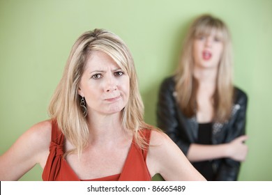 Angry Mom With Daughter In The Background