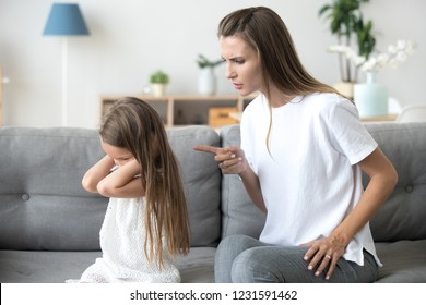 Angry Mother Scolding Lecturing Stubborn Kid Closing Ears Not Listening To Mom, Strict Mum Talking To Rebellious Child Demanding Discipline From Preschool Girl Ignoring Rebuke Family Conflict Concept