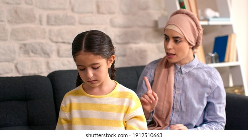 Angry Mother Threatening Her Daughter At Home, Yelling. 