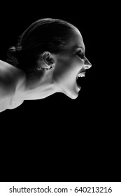 Angry Nude Girl Screaming On Black Background, Monochrome