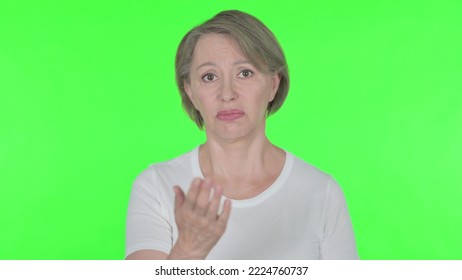 Angry Old Woman Arguing On Green Background