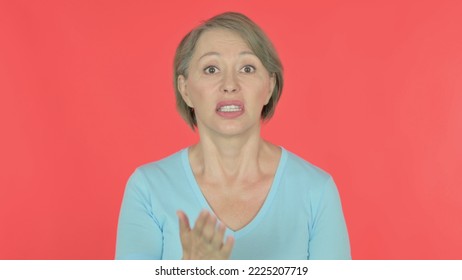 Angry Old Woman Arguing On Red Background